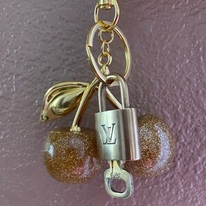 Louis Vuitton vintage brass lock/key with unbranded cherries keychain/bagcharm